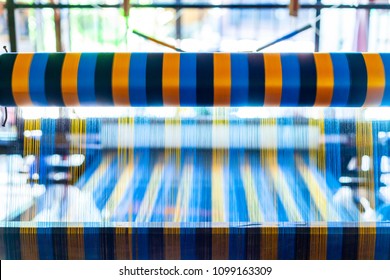 Close Up Hand Woven Cotton Weaver Machine Loom With Colorful Blue, Red, Yellow Silk Thread For Made Fabric In Thailand