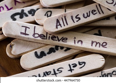close up of a hand written message on a popsicle stick as a self esteem building concept