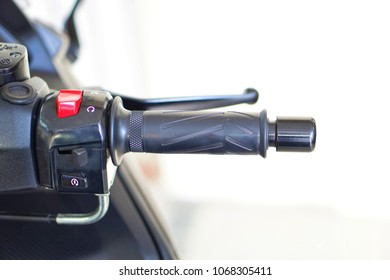 Close Up Of Handle Bar And Grip Big Bike, Motorcycle. Handle Bars Motorcycle On Blurred Background.