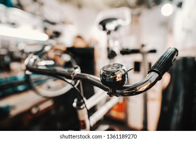 Close up of handlebar grip with bell on. Bicycle workshop interior. - Powered by Shutterstock