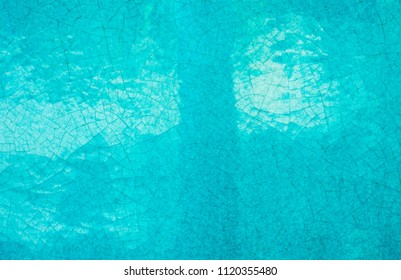 Close Up Handmade Glazed Pottery Ceramic Art Texture Surface, Bright Turquois Or Sapphire Blue Tone With Crack Random Line. Abstract Vintage, Contemporary, Antique Style Wallpaper Background.