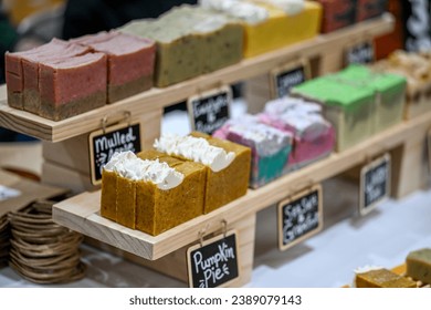 close up of handmade soaps on display of indoor farmers market