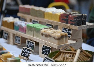 close up of handmade soaps on display of indoor farmers market