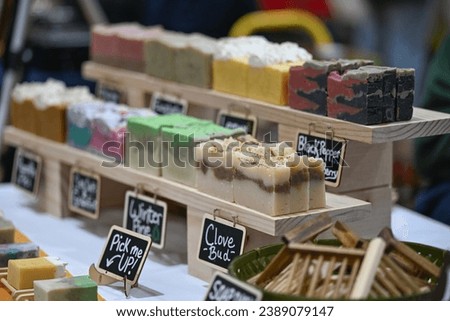 close up of handmade soaps on display of indoor farmers market