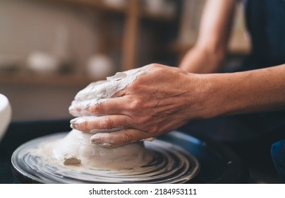 Close Up Of Hands Of 50 Years Old Female Sculptor Making Clay Pot On Pottery Wheel. Small Business And Entrepreneurship. Home Hobby And Leisure. Partial Image Of Woman At Art Studio