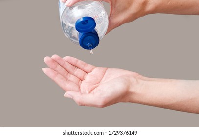 Close Up Of Hands Applying Asepsis, Cleaning Hands With Alcohol Gel