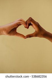 Close Up Of Hands Of Asian Girls Creating Heart Shape Symbol. A Sign Of Friendship.