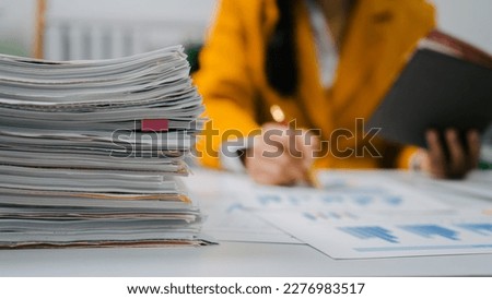 Close up hands of bookkeeper doing bookkeeping calculating audit, balance sheet and analyzing finances
