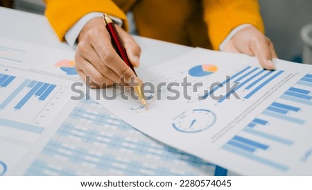 Close up hands of bookkeeper doing bookkeeping calculating audit, balance sheet and analyzing finances