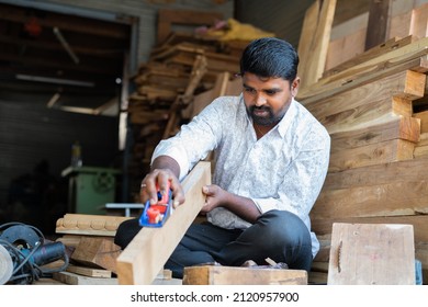 Close Up Hands Of Carpenter Busy Working By Using Block Plane For Removing Rough Surfaces On Wood At Shop - Concept Of Artisans, Self Employed And Skilled Labour