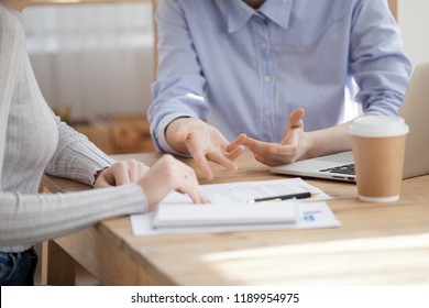 Close Up Hands Of Caucasian Millennial Women Sitting At The Desk. Advisor Interviewing New Candidate, Girls Colleague Coworking Together At Business Meeting Or Client Visit Real Estate Agency Office