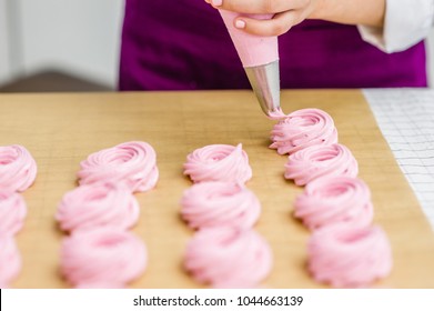 Close Up Hands Of The Chef With Confectionery Bag  Cream To Parchment Paper At Pastry Shop Kitchen