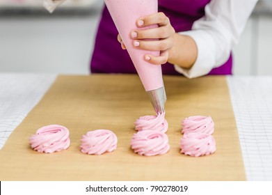 Close Up Hands Of The Chef With Confectionery Bag  Cream To Parchment Paper At Pastry Shop Kitchen