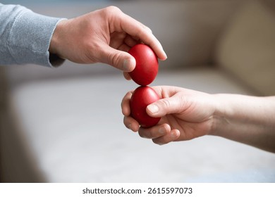 Close up of hands egg tapping
