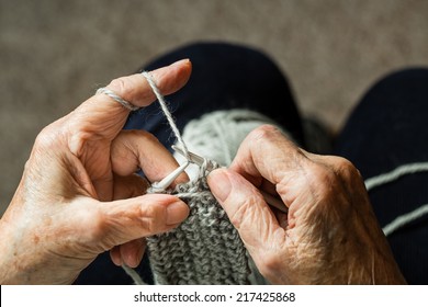 Close up of the hands of an elderly woman knitting. - Powered by Shutterstock