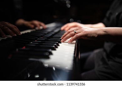 Close Up Of Hands Of A Female Piano Player