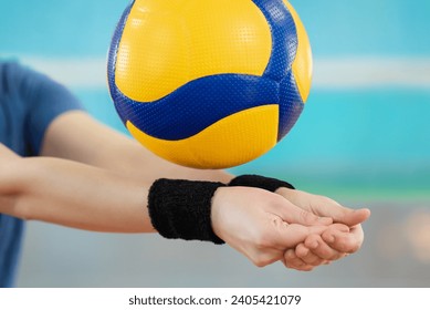 Close up of hands of a girl learning volleyball essential skills - digging. Volleyball female player practicing digging in volleyball game - Powered by Shutterstock