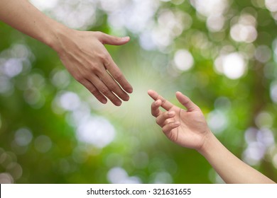 close up hands help pray gesture on blur green nature environment for better living concept ,victim of holocaust and social distance 