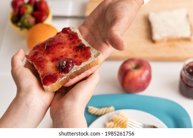 Close Up Hands Holding Bread Slice