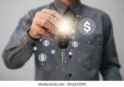 Close Up Hands Holding Car Keys. Man Holding Key Of Car Giving To Agent Of Insurance For Sell. Business Investment Insurance Car Seizure And Car Concept.