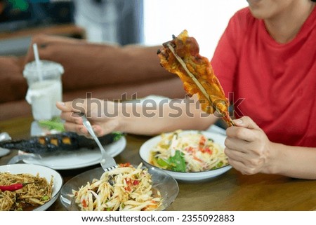 Close up hands holding chicken grill