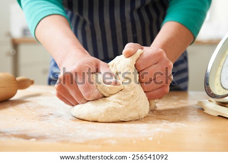 Close Up Of Hands Kneading Dough