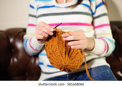 Close up of hands knitting. Process of knitting.