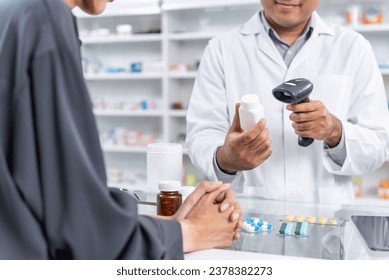 Close up hands of male pharmacist using barcode scanner for selling medicine to patient customer in the pharmacy drugstore, hand over capsule pills of medicine from hand to another hand charge. - Powered by Shutterstock