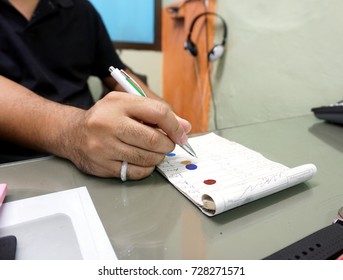   Close Up Hands Of Man Work As A Car Paint Mixing Technician Was To Examine Accounts.                             