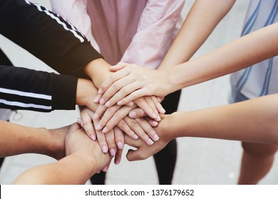 Close Up At The Hands Many Teenage Girls. Show Unity As A Collaborative Work Together. To Succeed, One Has To Understand Each Other In Communication. Concept International Women's Day