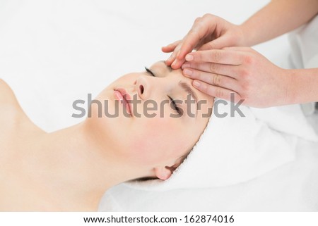 Similar – Young blond woman receiving a head massage