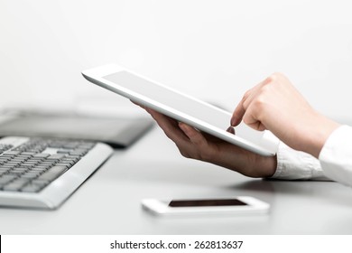 Close Up Hands Multitasking Woman Using Tablet, Laptop And Cellphone Connecting Wifi In Office