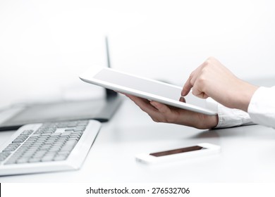 close up hands multitasking woman using tablet, laptop and cellphone connecting wifi in office - Powered by Shutterstock - Get 15% off with code: PIKWIZARD15