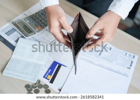 Close up hands open empty wallet of broke people on payday