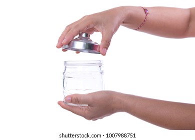 Close Up Of Hands Opening A Jar.