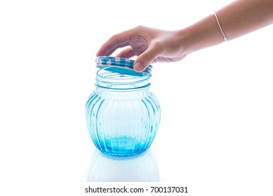 Close Up Of Hands Opening A Jar.