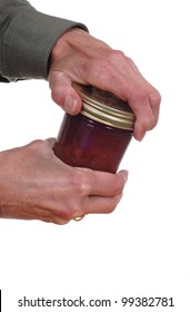 Close Up Of Hands Opening A Jar.