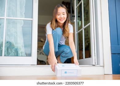 Close Up Hands Of Sick Asian Woman Sitting At Door To Receive Medication First Aid Pharmacy Box From Hospital Delivery Service At Floor Home, Female Patient Buy Drugstore Online Business, Healthcare