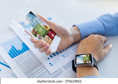 close up of hands with smart phone and watch - Powered by Shutterstock