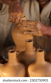 Close up hands of the traditional pottery making in the old way clay
 - Shutterstock ID 2302750901