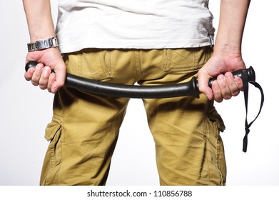 Close up of hands with truncheon.