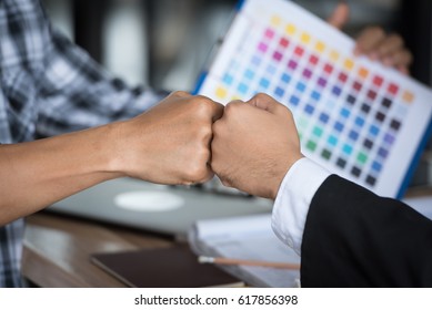 Close Up Hands Of Two Business Man Punching Fists Or Clash Of Two Fists.