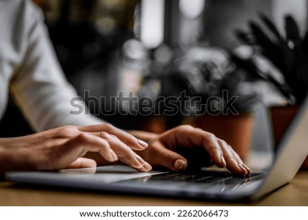 Close up hands typing keyboard