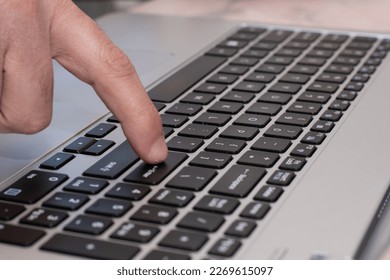 Close up of hands typing in the lapto