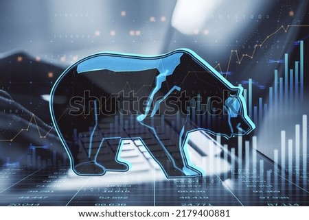Close up of hands using laptop with abstract hologram of bear on financial stock market graph representing stock market crash or down trend investment on blurry background. Double exposure