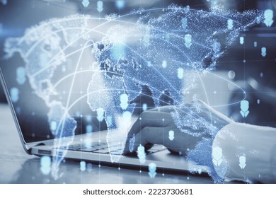 Close up of hands using laptop computer with abstract glowing map hologram on blurry background. Digital world, transformation and future cyber space concept. Double exposure