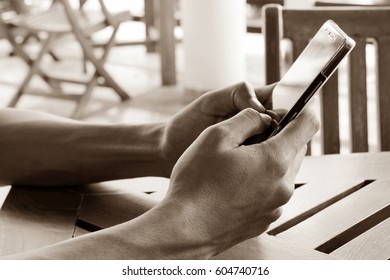 Close up hands using mobile smart phone.