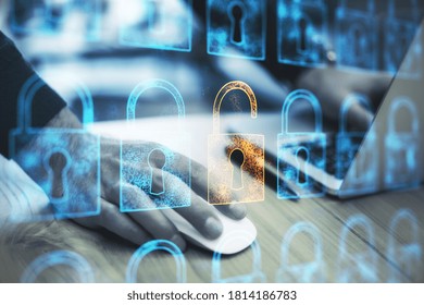 Close up of hands using mouse with digital padlock interface on desktop. Safety and protection concept. Multiexposure
