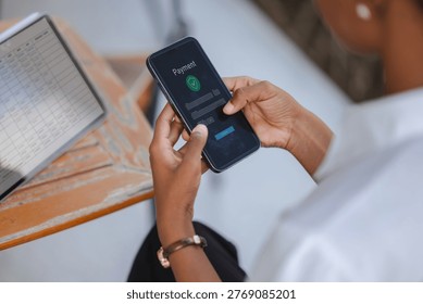 Close up of hands using smartphone with online payment interface beside tablet spreadsheet, concept of digital payment, fintech, ecommerce checkout, business finance and secure transaction. - Powered by Shutterstock - Get 15% off with code: PIKWIZARD15