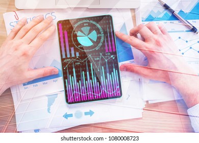 Close up of hands using tablet with abstract forex chart. Stock, finance and trade concept. Double exposure 